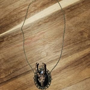 Mini deer skull pendant necklace may contain nickel